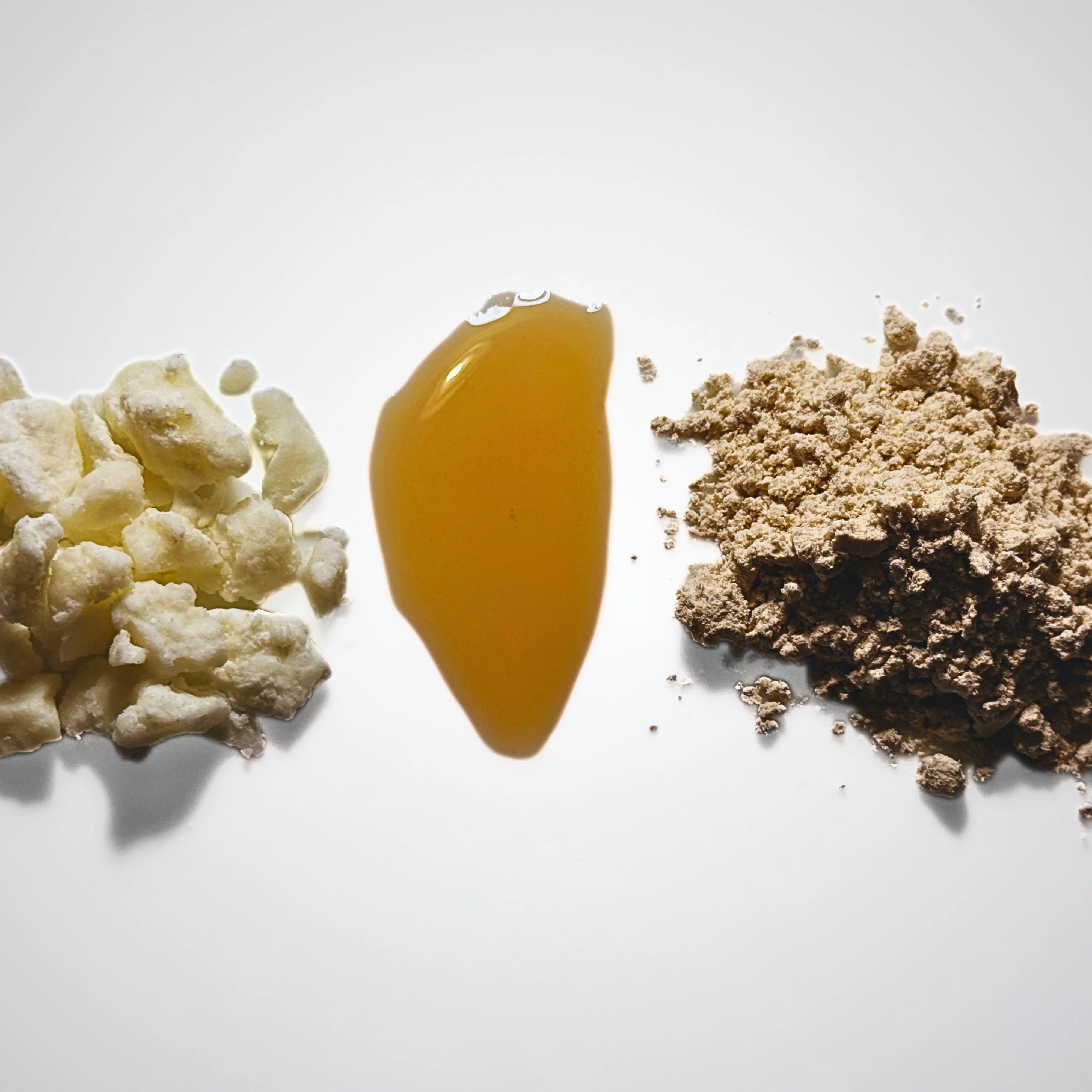Three types of natural resin or gum on a white background